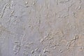 Abstract solid background coating putty with pearlescent paint rough wall surface with uneven coating with silver gold paint Royalty Free Stock Photo