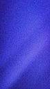 Abstract solid vertical background with subtle central illumination, featuring a rich grainy blur texture in deep royal blue and Royalty Free Stock Photo