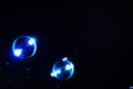 Abstract space background of blue soap bubbles with flare Royalty Free Stock Photo