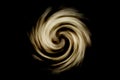 Abstract spiral galaxy with light brown smoke on black background