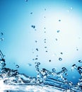 Abstract Splash of Water on a Blue Background Royalty Free Stock Photo