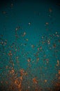 Abstract splashes of orange liquid on blue background