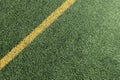 Abstract sport background. Green artificial grass turf soccer football field background with yellow line boundary. Top Royalty Free Stock Photo