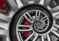 Abstract sport car spiral wheel rim with tire, brake disc. Automobile repetitive pattern background illustration. Car wheel and ti