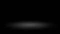 Abstract spotlight effect on a dark background with a soft grey gradient glow Royalty Free Stock Photo