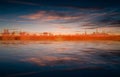 Abstract spring background with brown sunset and silhouette of Tallinn