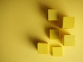 Abstract squares on a yellow background with shadows, top view, geometric shapes for demonstration Royalty Free Stock Photo