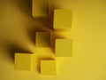 Abstract squares on a yellow background with shadows, top view, geometric shapes for demonstration Royalty Free Stock Photo