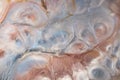 Abstract stains in pearlescent pink, blue and white. Background