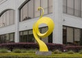 Abstract steel sculplture with yellow pain in front of a buidling at 3400 Carlisle Avenue in Dallas, Texas.