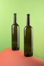 Abstract still life with color background and two glass bottles. Royalty Free Stock Photo