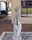 Abstract stone sculpture of the figure of a woman at Texas Women`s University in Denton.