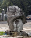 Abstract Stone turtle sculpture on display along a busy street in Hue, Vietnam