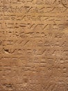 abstract stone wall background with egyptian hieroglyphs