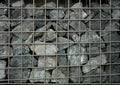 Abstract stones in metal squre cage wall for decoration Royalty Free Stock Photo