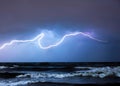 abstract storm over wavy sea with lighting, overcast, bad weather created with generative ai technology Royalty Free Stock Photo