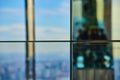 Abstract straight on glass reflection wall with dividing panels and soft blue lights