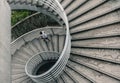 Street Photography of Man Walking Down Spiral Stairs in Hong Kong Royalty Free Stock Photo