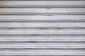 Abstract stripe pattern of white metallic roller shutter doors