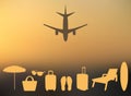 Abstract summer background in a blurry sunset and with silhouettes of the plane, suitcase, parasol, chaise, flip-flops, beach bag, Royalty Free Stock Photo