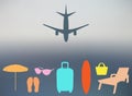 Abstract summer background in a blurry sunset and with silhouettes of the plane, suitcase, parasol, chaise, flip-flops, beach bag,