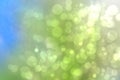 Abstract sunny bright green blue bokeh autumn background texture with leaves. Space for your design. Beautiful green illustration Royalty Free Stock Photo