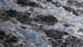 Abstract Surface Texture of Blue Pearl Granite with Swirling Patterns for Architectural Design Royalty Free Stock Photo