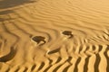 Abstract and surreal landscape view of sand dunes and blue water