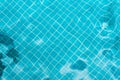 Abstract swimming pool bottom caustics ripple and flow with waves background. Summer background. Texture of water surface.