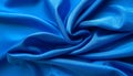 Abstract Swirl of Royal Blue Satin Fabric with Dramatic Light and Shadow Play silk textile Royalty Free Stock Photo