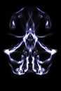 Abstract symetrical shaped smoke against black background