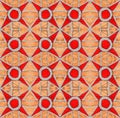 Abstract symmetrical textured geometric pattern in red color. Seamless background.
