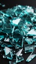 Abstract teal glass shards scattered on a dark background reflecting light Royalty Free Stock Photo