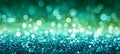 Abstract teal and green glitter defocused background texture with glowing lights and bokeh. Royalty Free Stock Photo