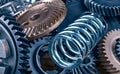 Steel coil spring and various gearwheels close-up Royalty Free Stock Photo