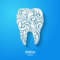 Abstract teeth silhouette. Ornate floral white tooth symbol on blue background. Medical dentist dental clinic sign icon logo. Royalty Free Stock Photo