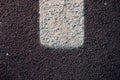 Abstract texture of a asphalt road with white paint Royalty Free Stock Photo