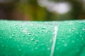 Abstract texture background of beautiful raindrop or water drops on  green-white umbrella surface Royalty Free Stock Photo