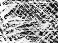 Abstract texture of chaotic markings on a dark surface created by scratching or scraping during a creative activity Royalty Free Stock Photo