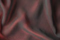 abstract texture of draped red velvet background. eautiful textile backdrop. Close-up. Top view