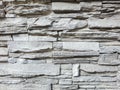 Abstract texture of gray stone facing on the wall of the building. Gray stone background. Selective focus Royalty Free Stock Photo