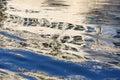 Texture of boat reflection in turbulent river colored with sunlight Royalty Free Stock Photo