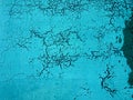 Abstract texture turquoise background with cracks and craquelure
