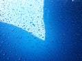 Abstract, texture, water droplets on car glass, image for blue background, rainy season concept, selectable focus. Royalty Free Stock Photo