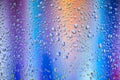 Abstract texture. Water drops on glass with blue and purple background Royalty Free Stock Photo