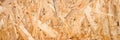Abstract textured background of compressed plywood. texture of light brown pressed wooden board chipboard. top view, close up. ban