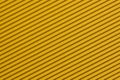 Textured colorful yellow corrugated cardboard