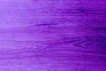 Seamless background of purple stained wooden board