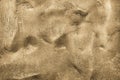 Abstract textured bumpy background of a surface bronze sand color