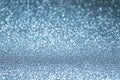 Abstract textured festive sparkling blue defocus lights background, selective focus Royalty Free Stock Photo